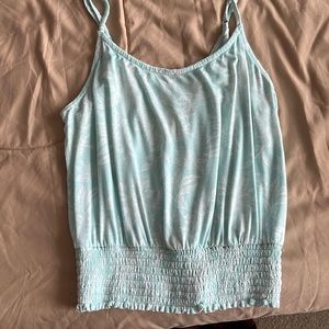 Light blue floral tank top with touched bottom